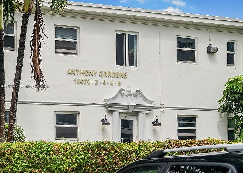 10070 Southeast East Bay Harbor Drive, Unit 70C Bay Harbor Islands, FL 33154 - Photo 3 of 17 a front view of a house with a garden