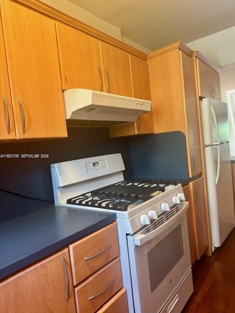 10070 Southeast East Bay Harbor Drive, Unit 70C Bay Harbor Islands, FL 33154 - Photo 9 of 17 a stove top oven sitting inside of a kitchen