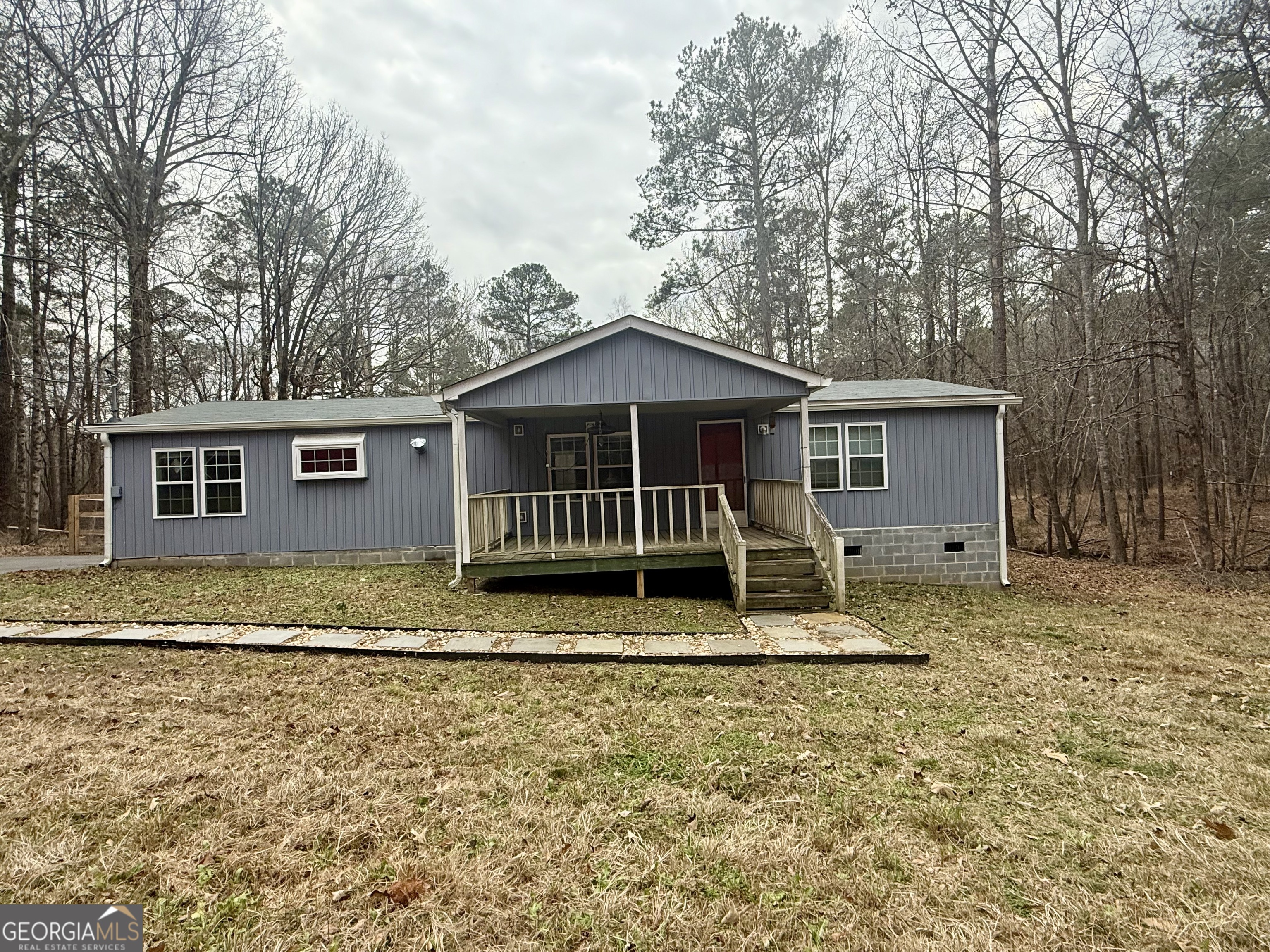 a house with trees in the background