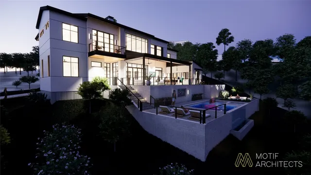 a view of a house with pool and sitting area