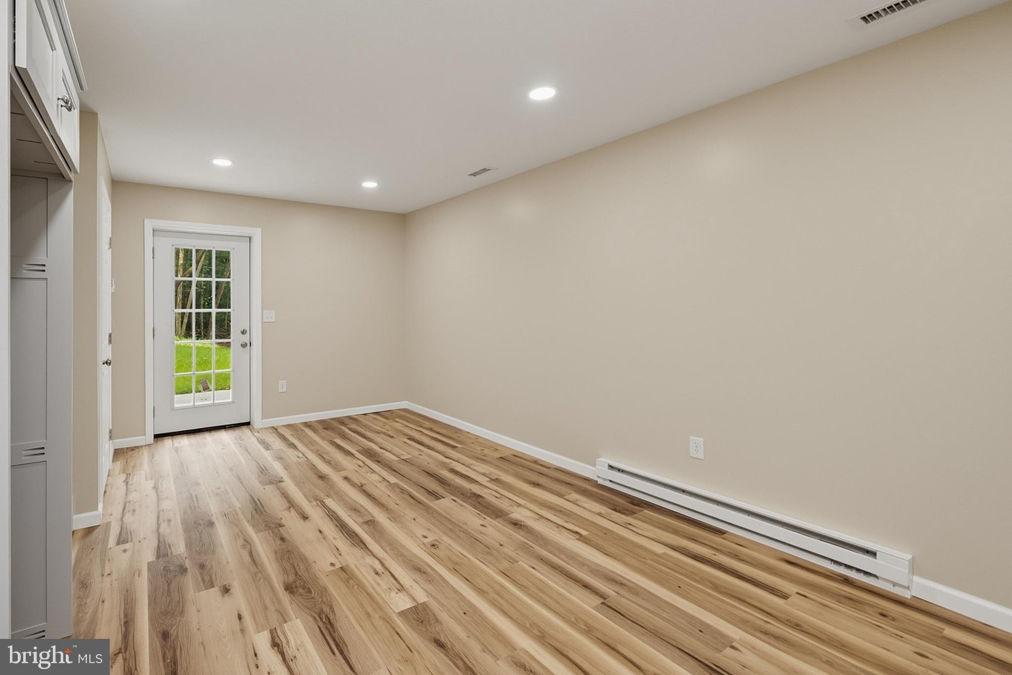 114 Dripping Spring Road Morgantown, WV 26508 - Photo 95 of 102 a view of an empty room with wooden floor and a window