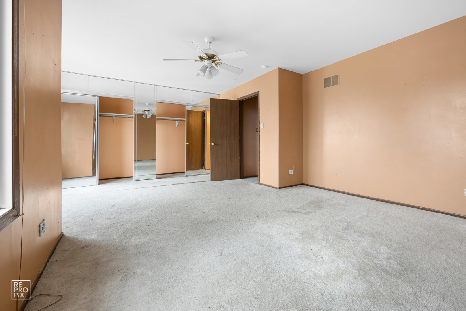 45 Churn Road Matteson, IL 60443 - Photo 12 of 14 a view of an empty room with a chandelier fan