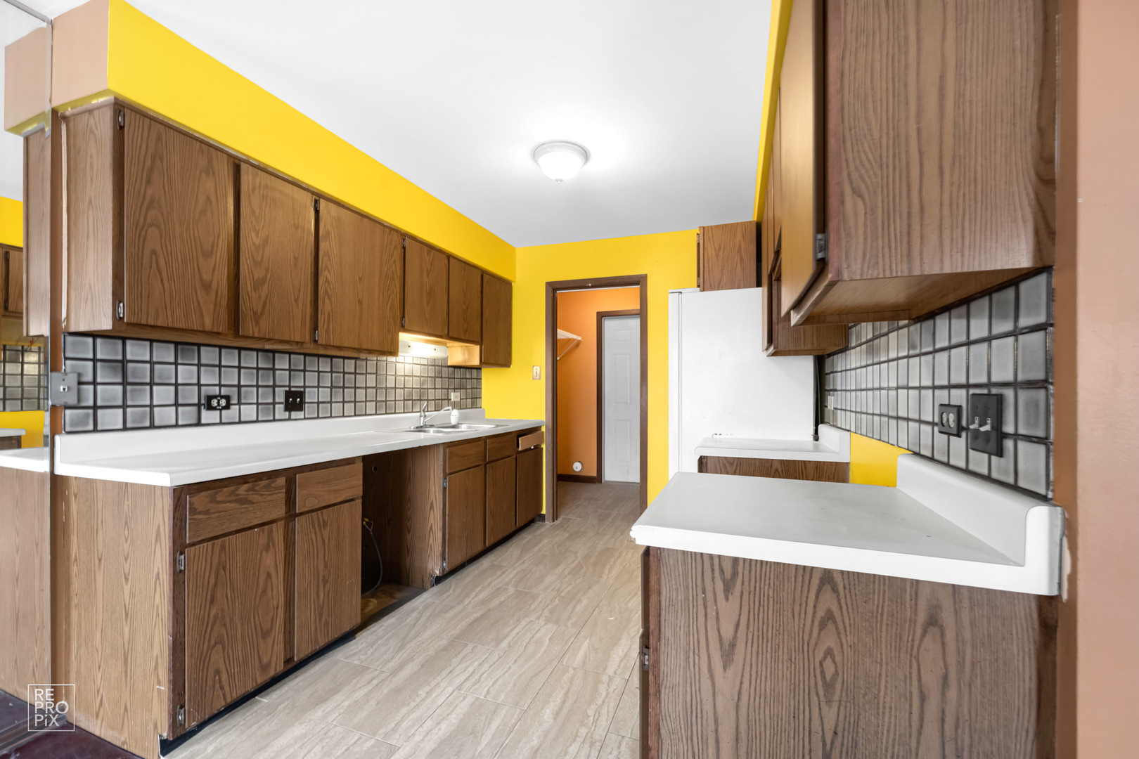 45 Churn Road Matteson, IL 60443 - Photo 8 of 14 a kitchen with a sink a stove and cabinets