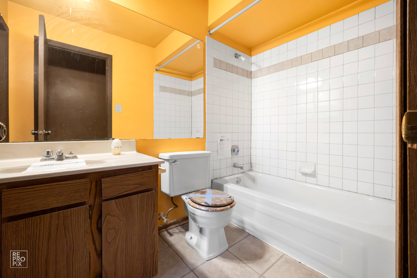 45 Churn Road Matteson, IL 60443 - Photo 10 of 14 a bathroom with a sink and mirror with toilet