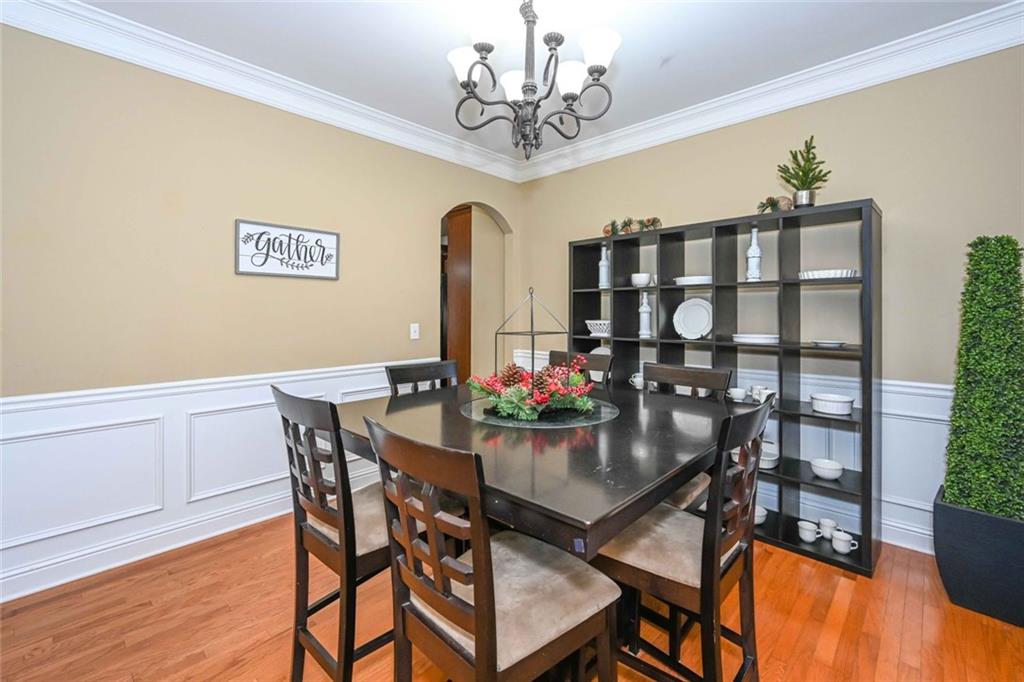 1024 Landon Drive Villa Rica, GA 30180 - Photo 11 of 50 a view of a dining room with furniture and chandelier