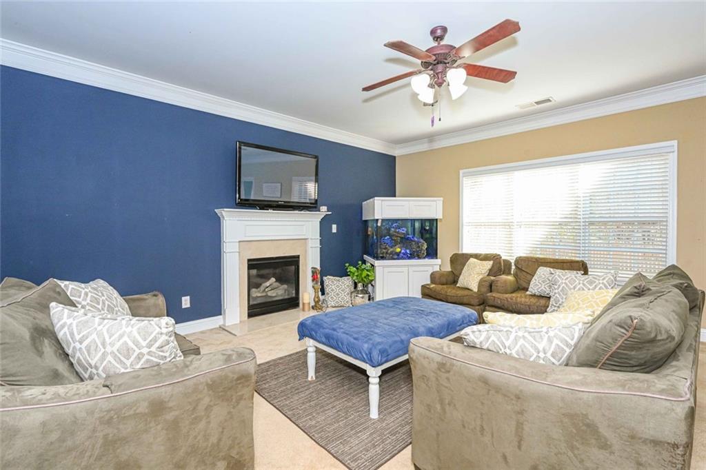 1024 Landon Drive Villa Rica, GA 30180 - Photo 15 of 50 a living room with furniture and a fireplace