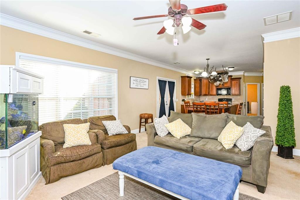 1024 Landon Drive Villa Rica, GA 30180 - Photo 17 of 50 a living room with furniture and a large window