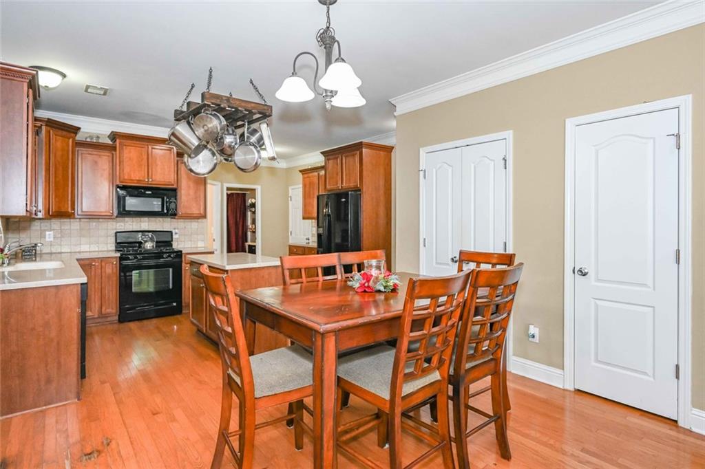 1024 Landon Drive Villa Rica, GA 30180 - Photo 19 of 50 a view of a dining room with furniture and wooden floor