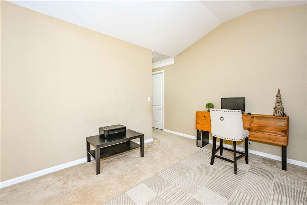 1024 Landon Drive Villa Rica, GA 30180 - Photo 25 of 50 a bench sitting in a room next to a chair