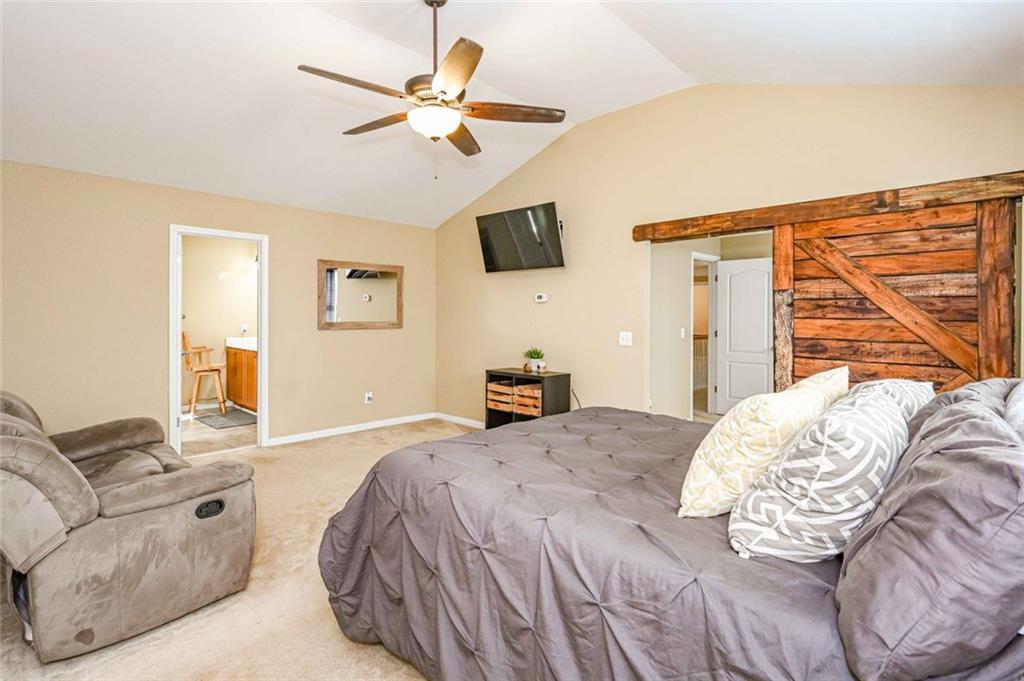 1024 Landon Drive Villa Rica, GA 30180 - Photo 29 of 50 a bedroom with a bed couch and window