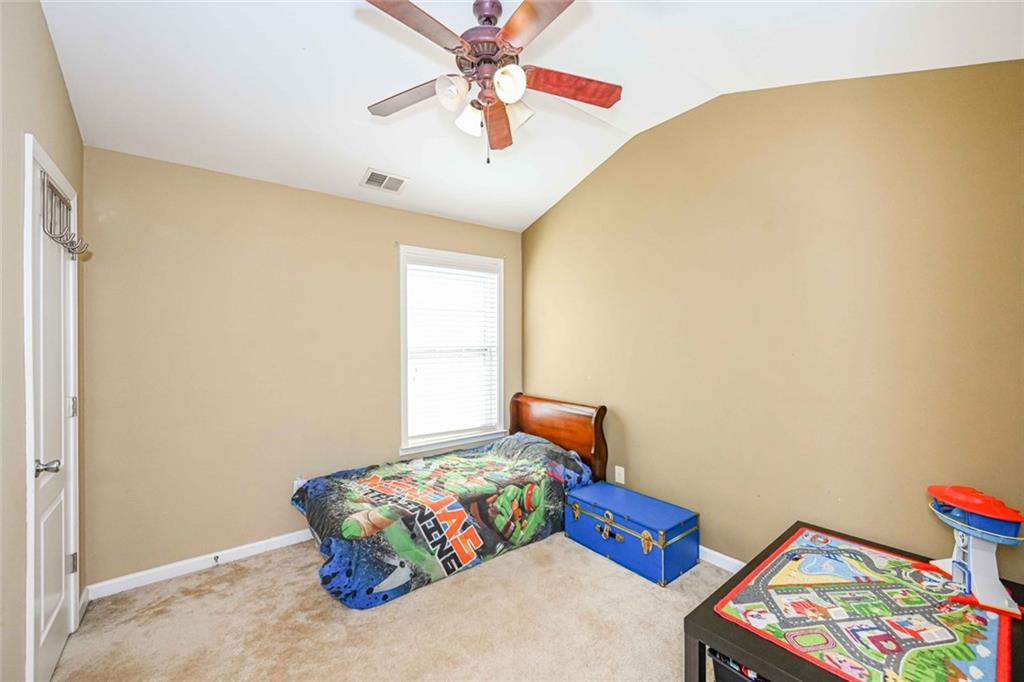 1024 Landon Drive Villa Rica, GA 30180 - Photo 33 of 50 a bedroom with furniture and a window