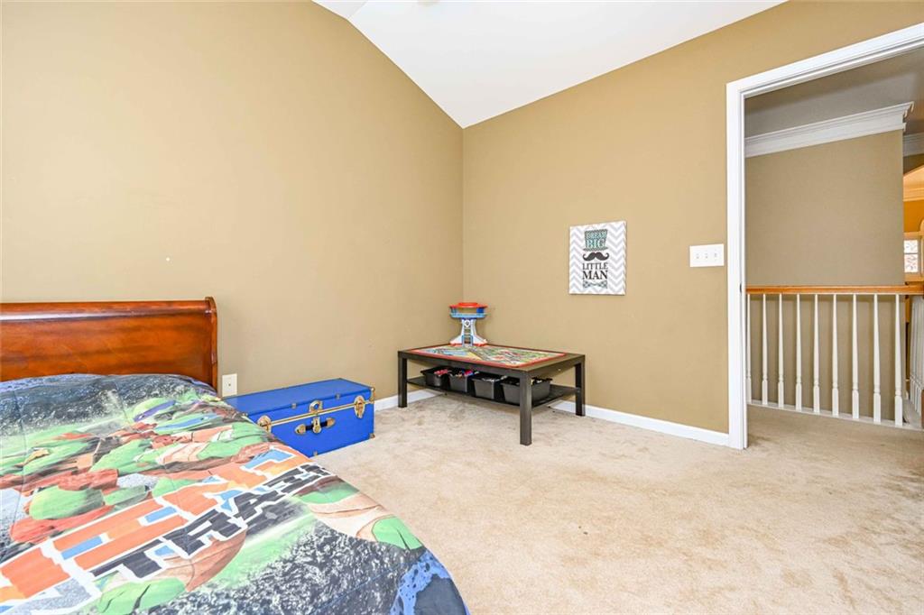 1024 Landon Drive Villa Rica, GA 30180 - Photo 34 of 50 a bedroom with a bed and a table