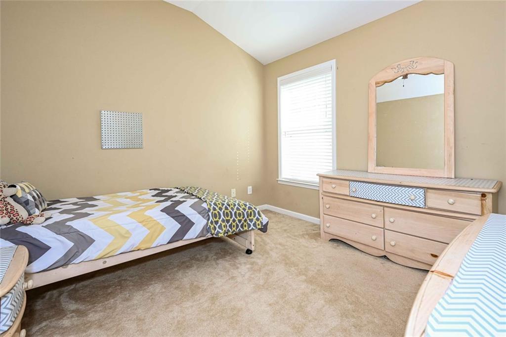 1024 Landon Drive Villa Rica, GA 30180 - Photo 35 of 50 a bedroom with a bed and a window