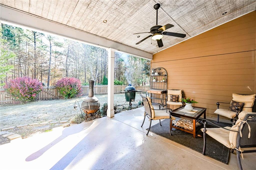1024 Landon Drive Villa Rica, GA 30180 - Photo 47 of 50 a view of a patio with table and chairs and potted plants