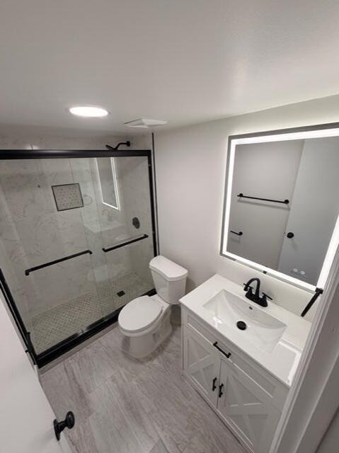 9374 Southwest 3rd Street, Unit 714 Boca Raton, FL 33428 - Photo 18 of 21 a bathroom with a sink toilet and shower