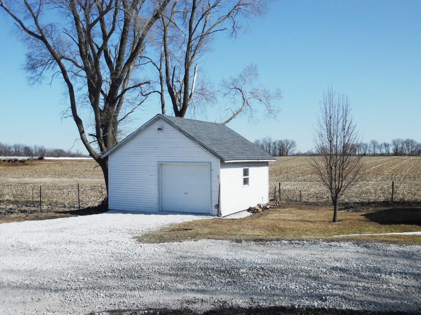 2300 Highway 23 Grand Ridge, IL 61325 - Photo 2 of 13 a view of a white house next to a road and a yard