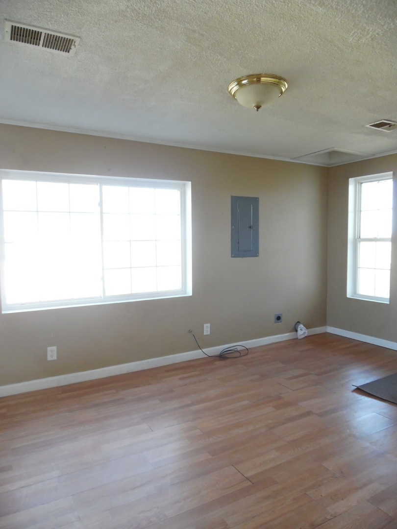 2300 Highway 23 Grand Ridge, IL 61325 - Photo 12 of 13 a view of an empty room with wooden floor and a window