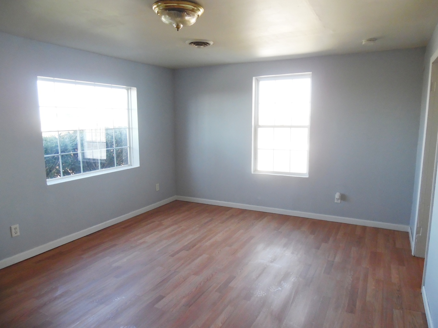 2300 Highway 23 Grand Ridge, IL 61325 - Photo 4 of 13 a view of an empty room with wooden floor and a window