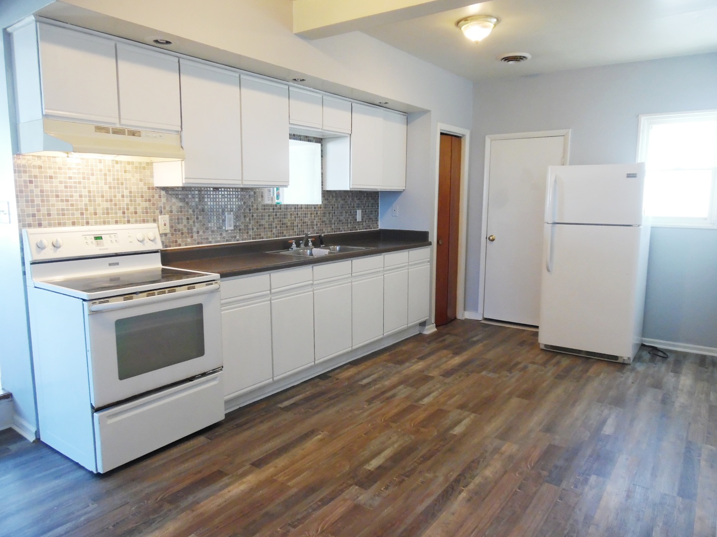 2300 Highway 23 Grand Ridge, IL 61325 - Photo 6 of 13 a kitchen with a sink cabinets stainless steel appliances and window