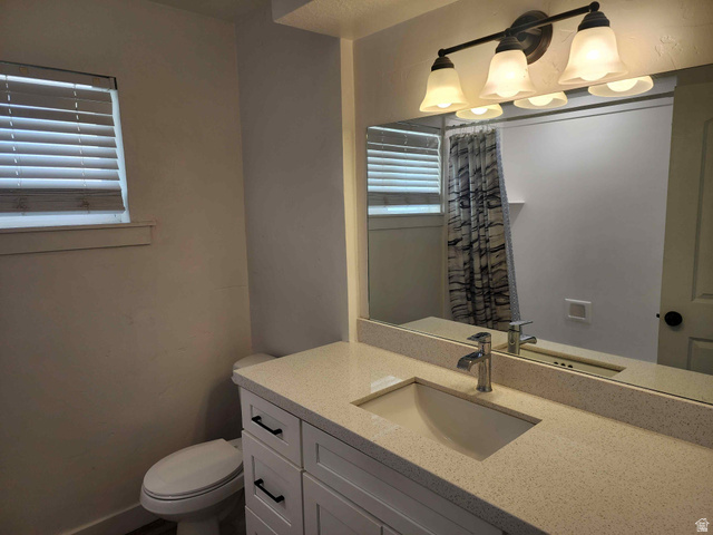545 100 East Bountiful, UT 84010 - Photo 11 of 17 Bathroom featuring vanity and toilet