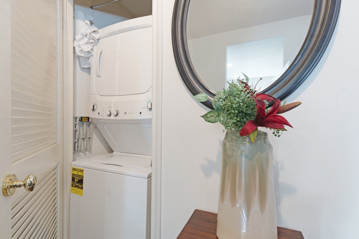 2323 Fairwind Drive, Unit 858 Houston, TX 77062 - Photo 11 of 20 a vase with flowers sitting on a table