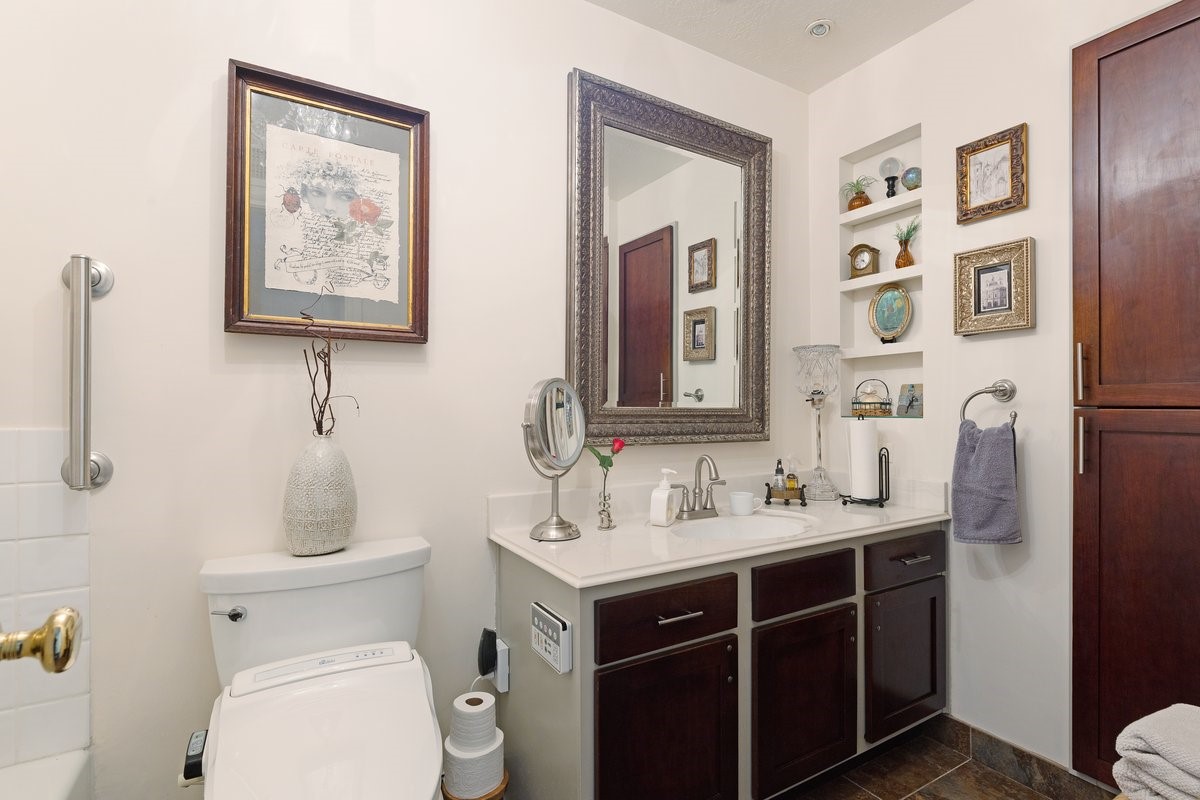 2323 Fairwind Drive, Unit 858 Houston, TX 77062 - Photo 14 of 20 a bathroom with a toilet sink and mirror