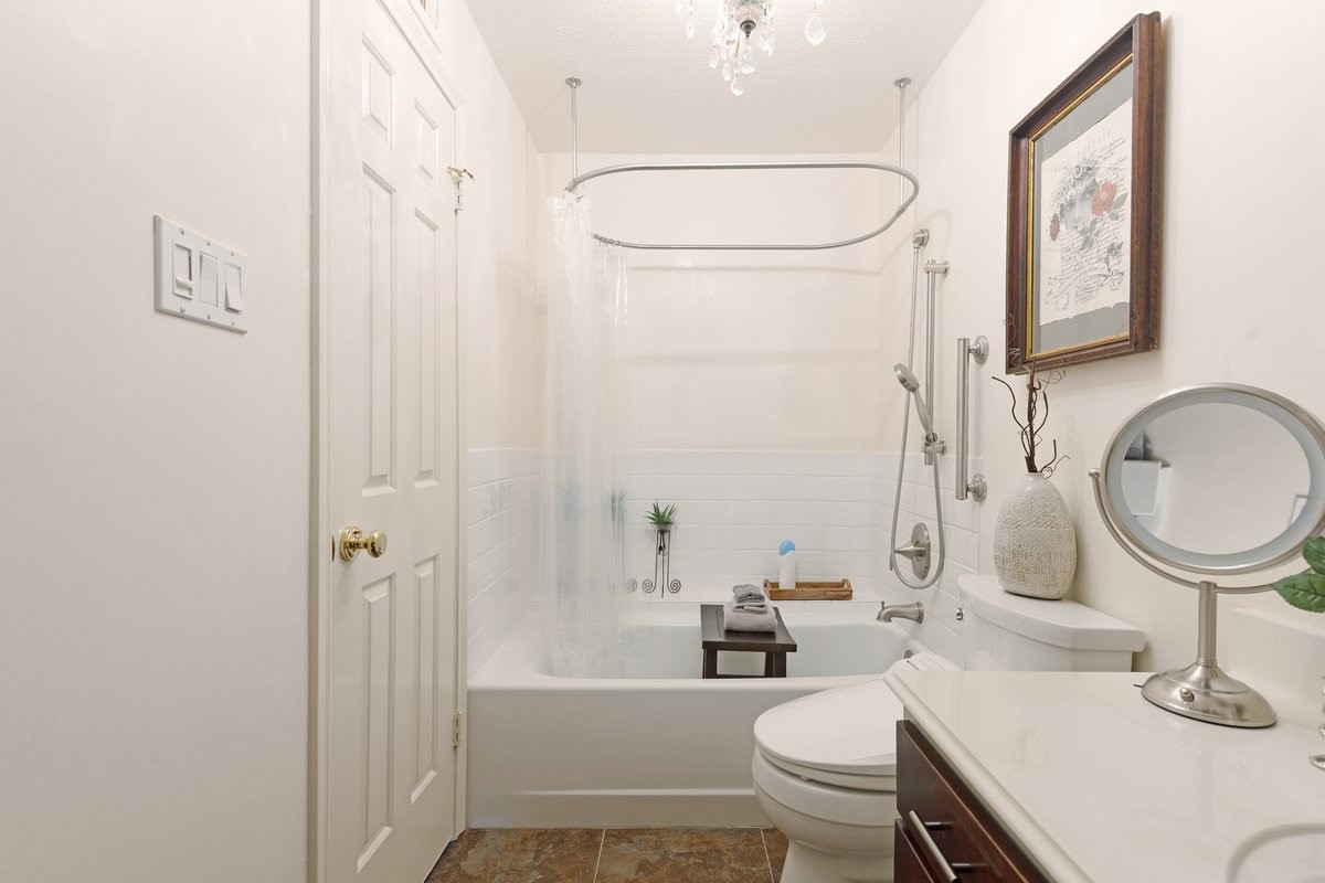 2323 Fairwind Drive, Unit 858 Houston, TX 77062 - Photo 15 of 20 a bathroom with a sink a toilet and shower