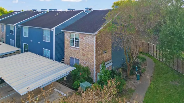 a aerial view of a house with a yard