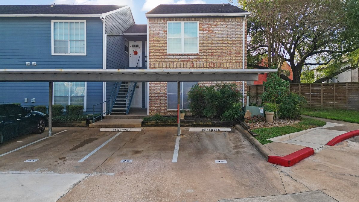 2323 Fairwind Drive, Unit 858 Houston, TX 77062 - Photo 2 of 20 a house view with a outdoor space