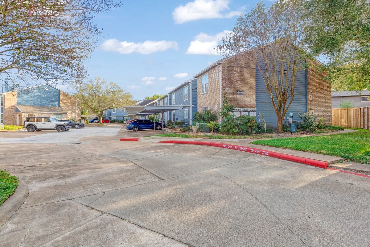 2323 Fairwind Drive, Unit 858 Houston, TX 77062 - Photo 3 of 20 a view of street with tall buildings