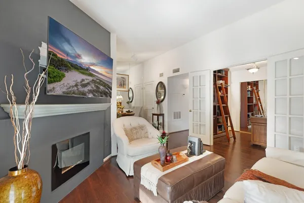 a living room with furniture and a fireplace