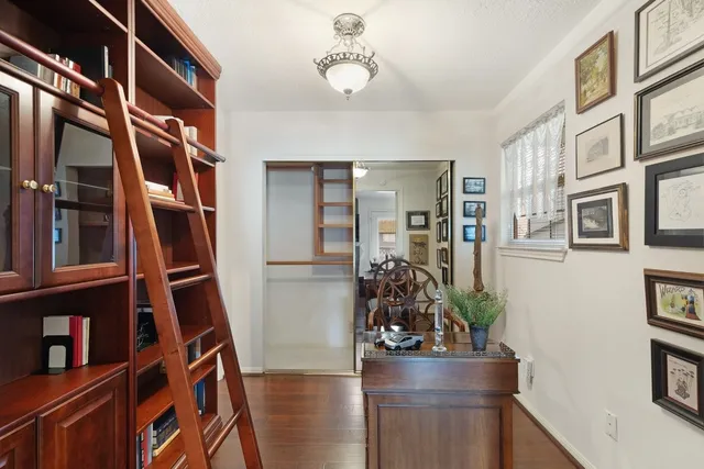 a view of an entryway with wooden floor and a potted plant