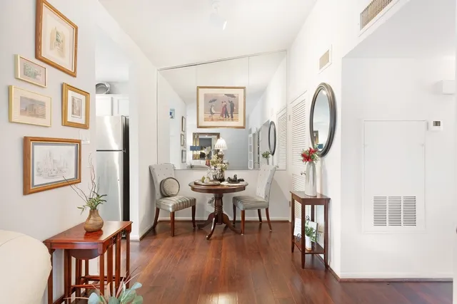 a view of a livingroom with furniture and a wooden floor