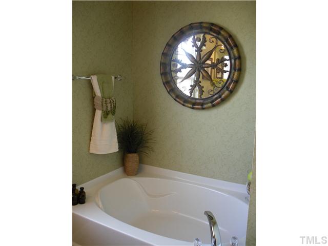 3011 Berkeley Street, Unit 177 Raleigh, NC 27612 - Photo 7 of 17 Master bath features separate tub and shower.