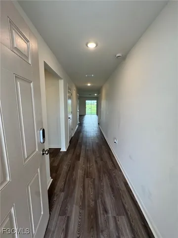 a view of gallery with wooden floor