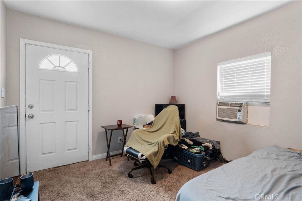 3974 5th Street Riverside, CA 92501 - Photo 22 of 45 a bedroom with a bed and a window