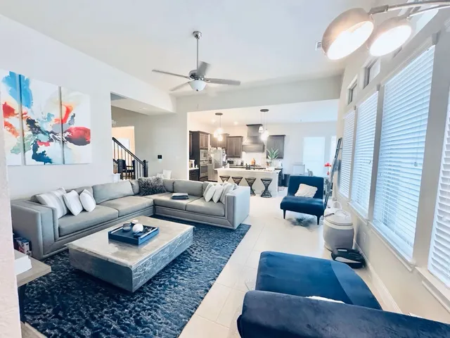 a living room with furniture or couch and a wooden floor