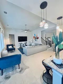 a living room with furniture and a table