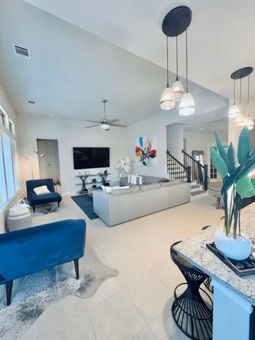 a living room with furniture and a table