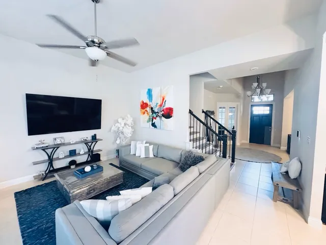 a living room with furniture and a flat screen tv