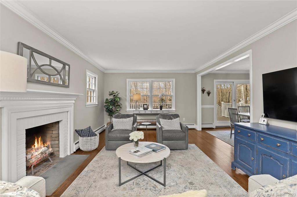 183 Frogtown Road New Canaan, CT 06840 - Photo 5 of 37 a living room with furniture and a fireplace
