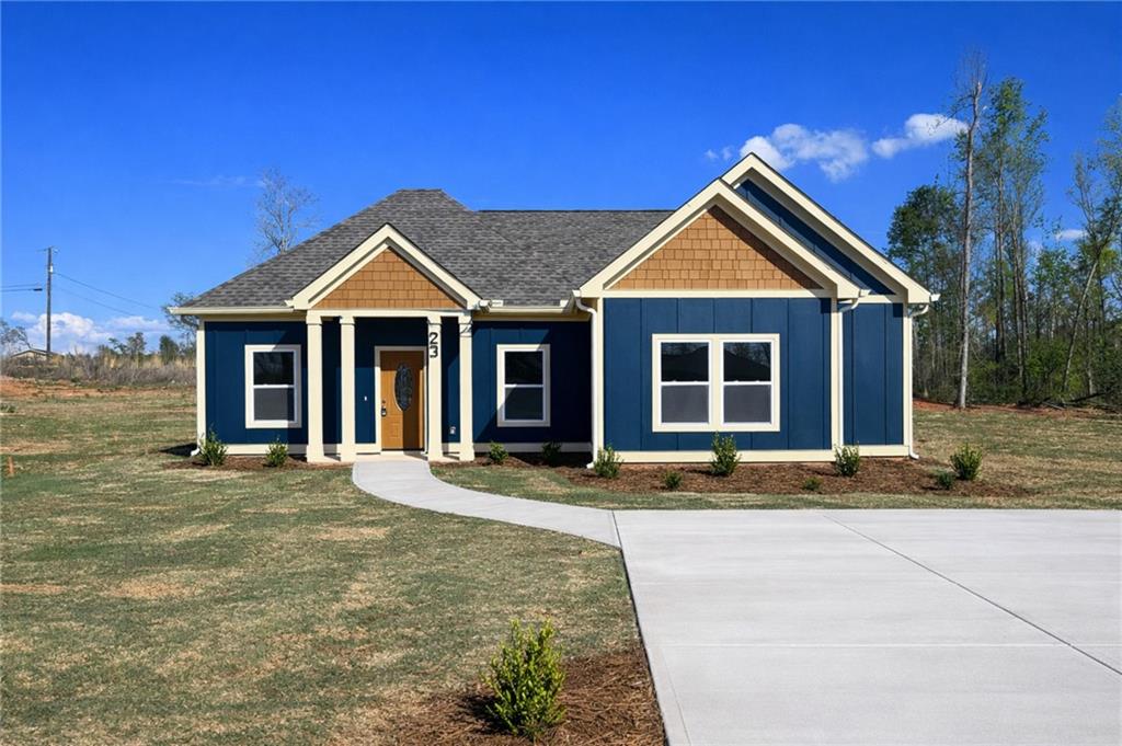 23 S Road Griffin, GA 30224 - Photo 1 of 32 a front view of a house with a garden and yard