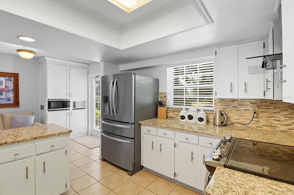 12550 Southwest 16th Avenue Ocala, FL 34476 - Photo 11 of 63 a kitchen with a sink stove and refrigerator