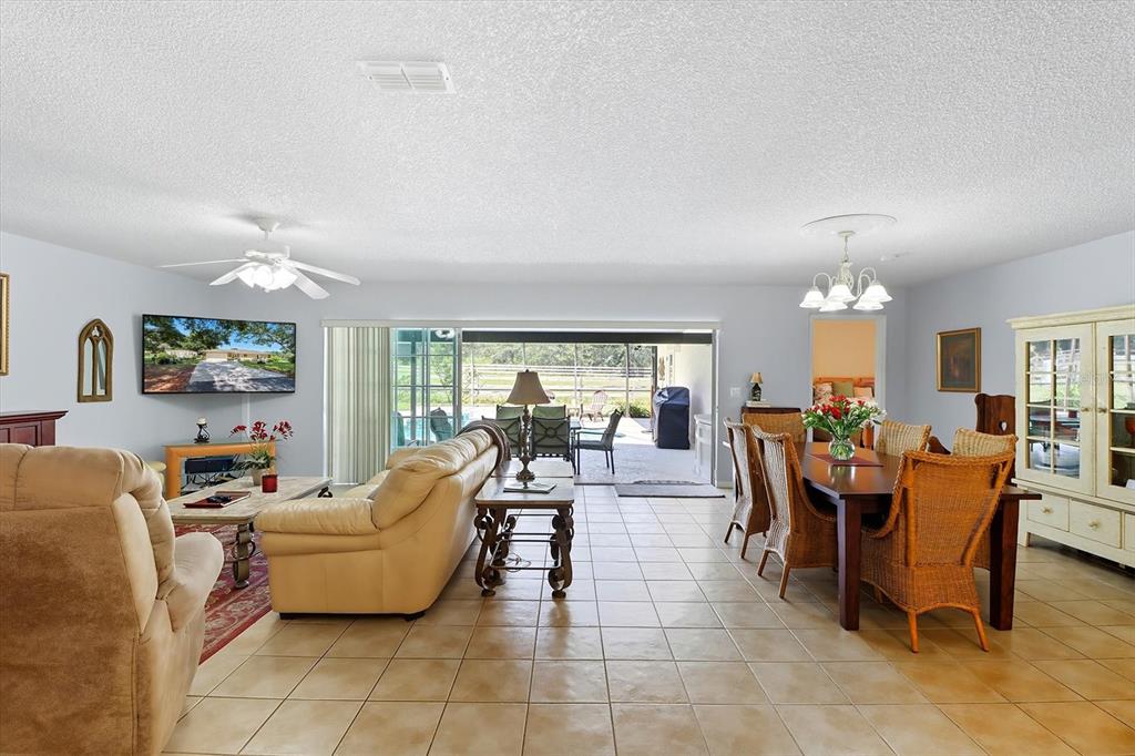 12550 Southwest 16th Avenue Ocala, FL 34476 - Photo 14 of 63 a living room with furniture and a large window