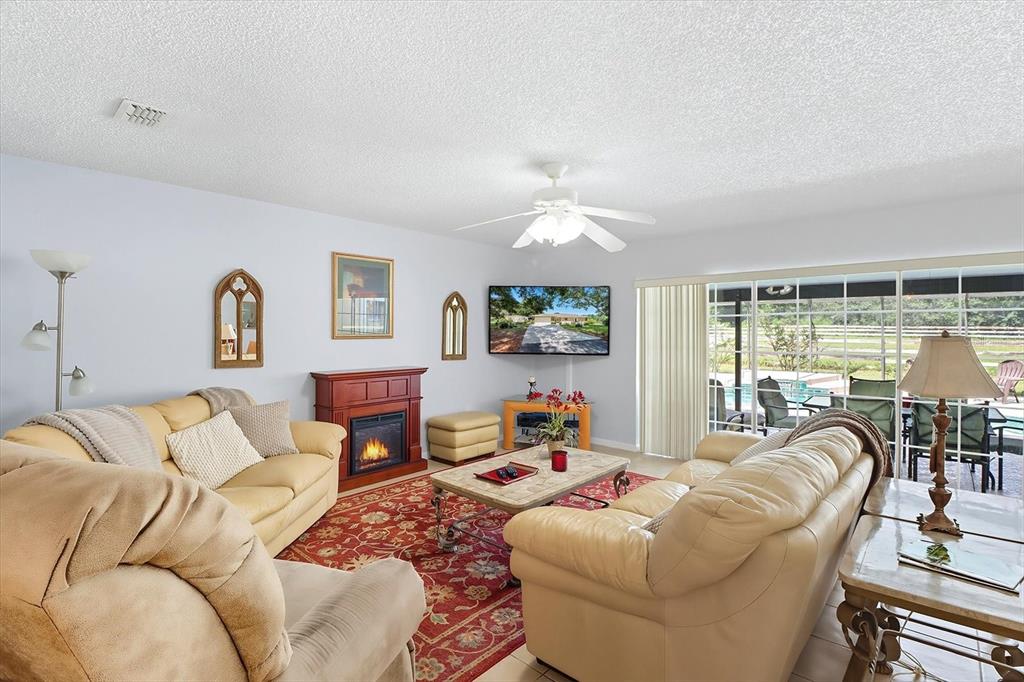12550 Southwest 16th Avenue Ocala, FL 34476 - Photo 15 of 63 a living room with furniture and a large window
