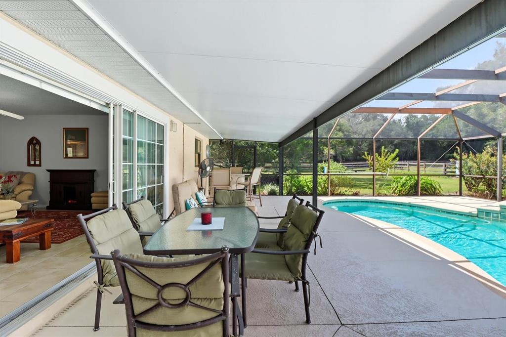 12550 Southwest 16th Avenue Ocala, FL 34476 - Photo 18 of 63 a view of an outdoor dining space with a table and chairs