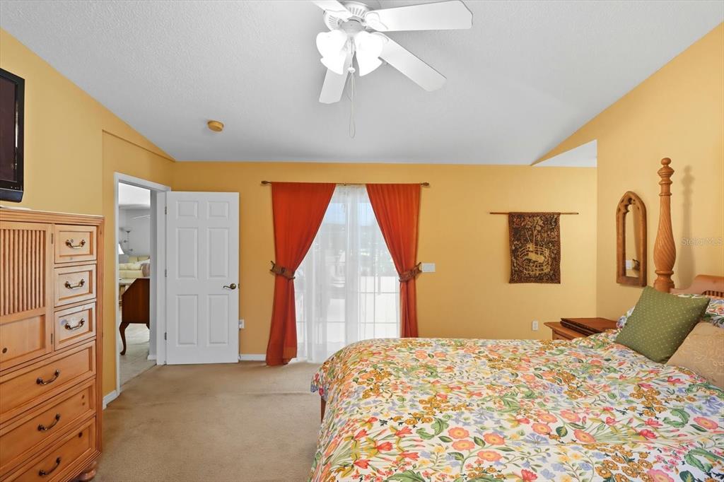 12550 Southwest 16th Avenue Ocala, FL 34476 - Photo 23 of 63 a bedroom with a bed and a dresser