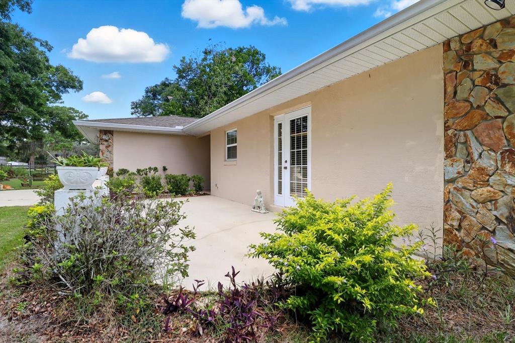 12550 Southwest 16th Avenue Ocala, FL 34476 - Photo 30 of 63 a view of a yard with plants and a fountain