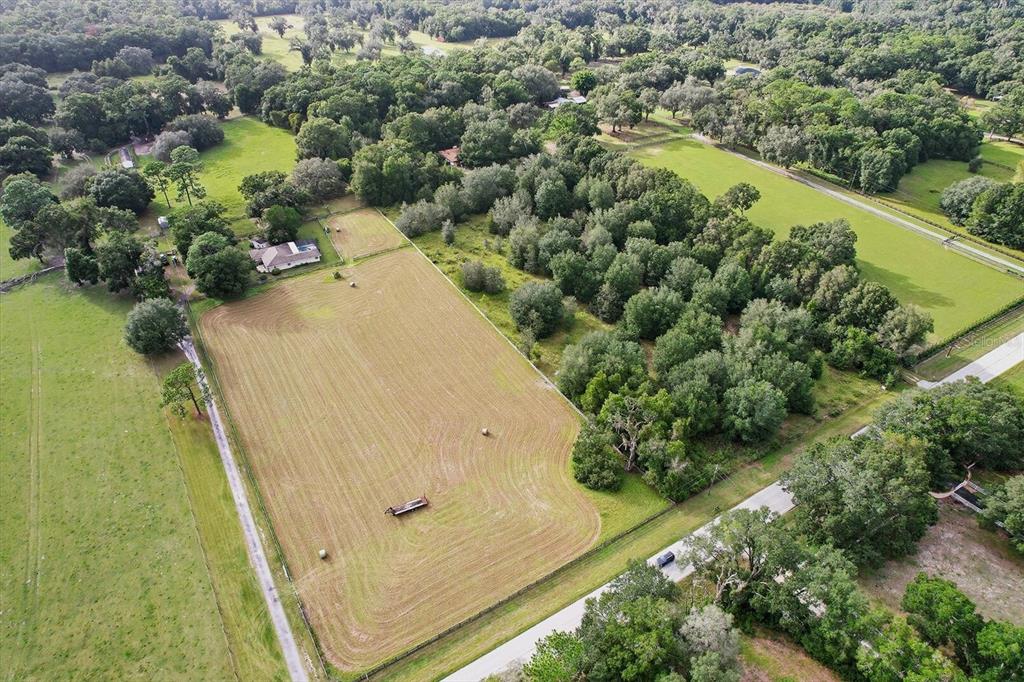 12550 Southwest 16th Avenue Ocala, FL 34476 - Photo 58 of 63 an aerial view of a house with a yard and lake view