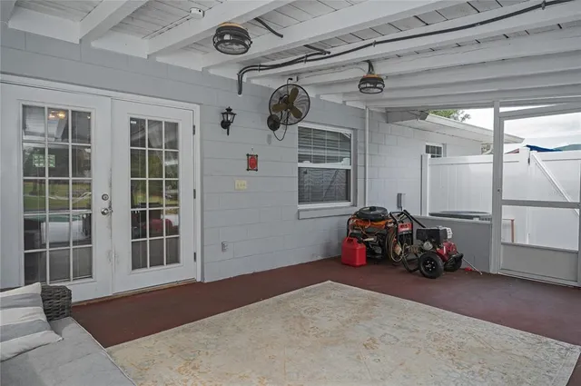 a bedroom with furniture and a window